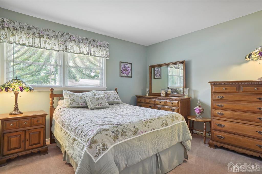 8 Tamarack Road Edison, NJ 08820 - Photo 16 of 31 a bedroom with a bed and a dresser
