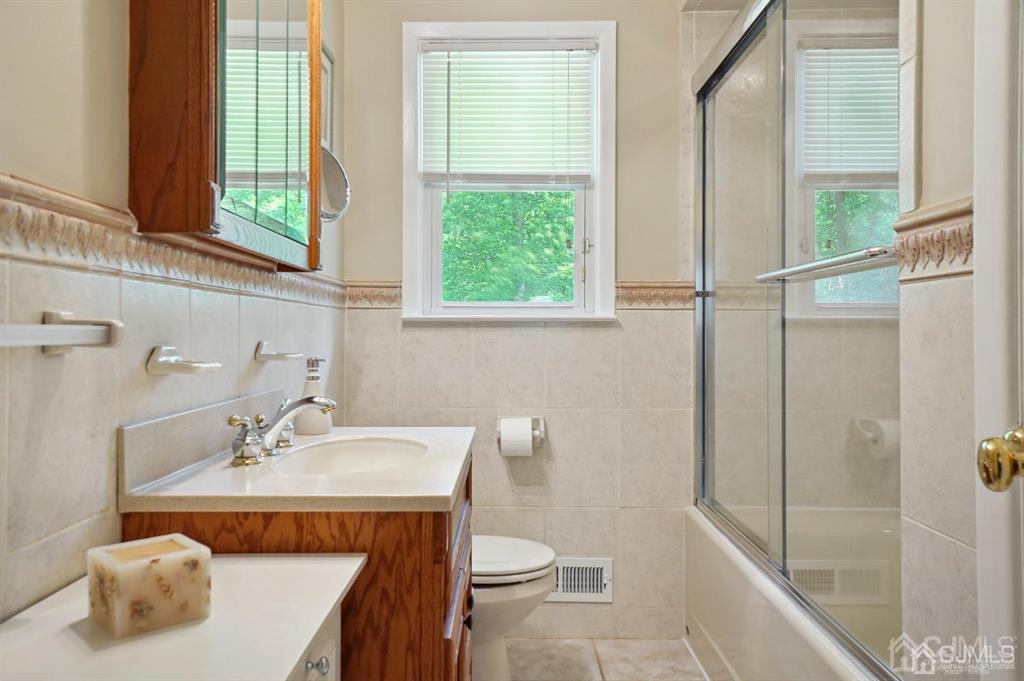 8 Tamarack Road Edison, NJ 08820 - Photo 17 of 31 a bathroom with a sink a toilet and shower