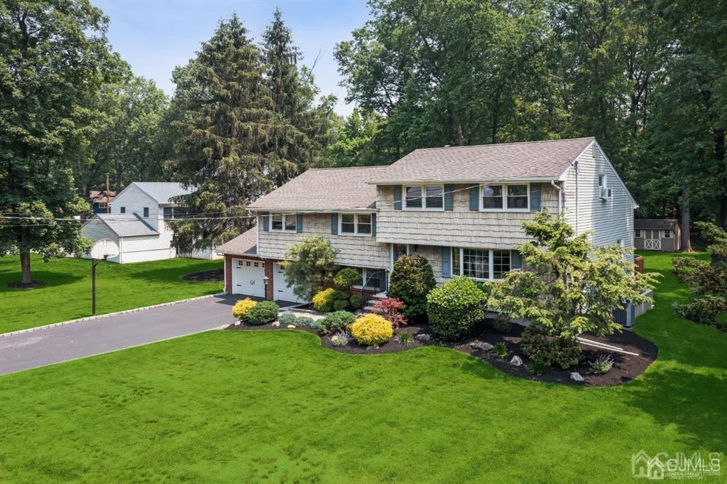 8 Tamarack Road Edison, NJ 08820 - Photo 28 of 31 a front view of a house with garden