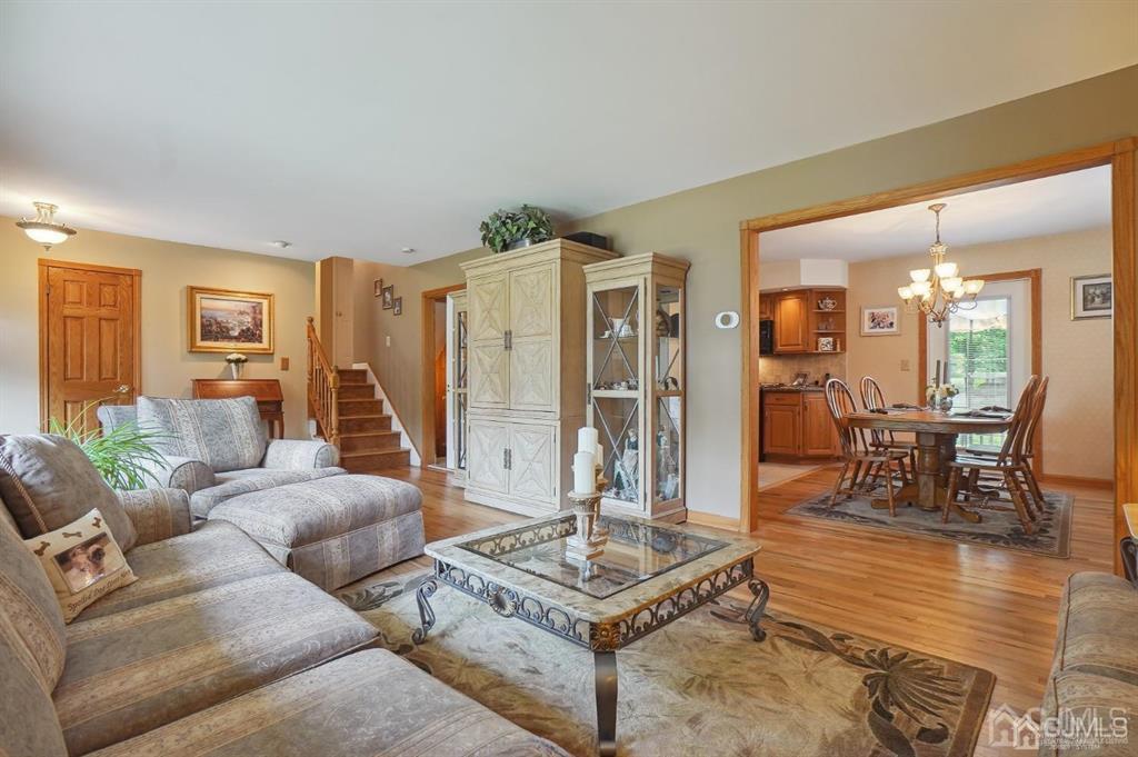 8 Tamarack Road Edison, NJ 08820 - Photo 4 of 31 a living room with furniture and a table