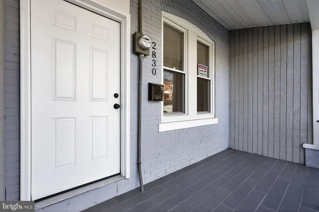 a view of an entryway with wooden floor