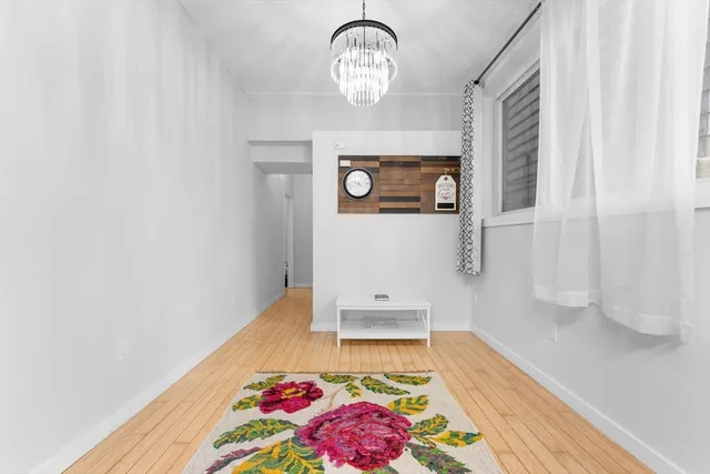 a view of entryway with wooden floor