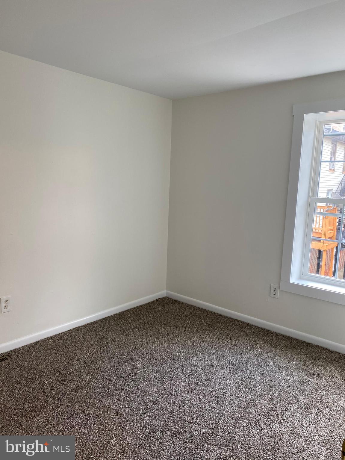 323 East Chestnut Street, Unit 5 Coatesville, PA 19320 - Photo 6 of 7 an empty room with a window