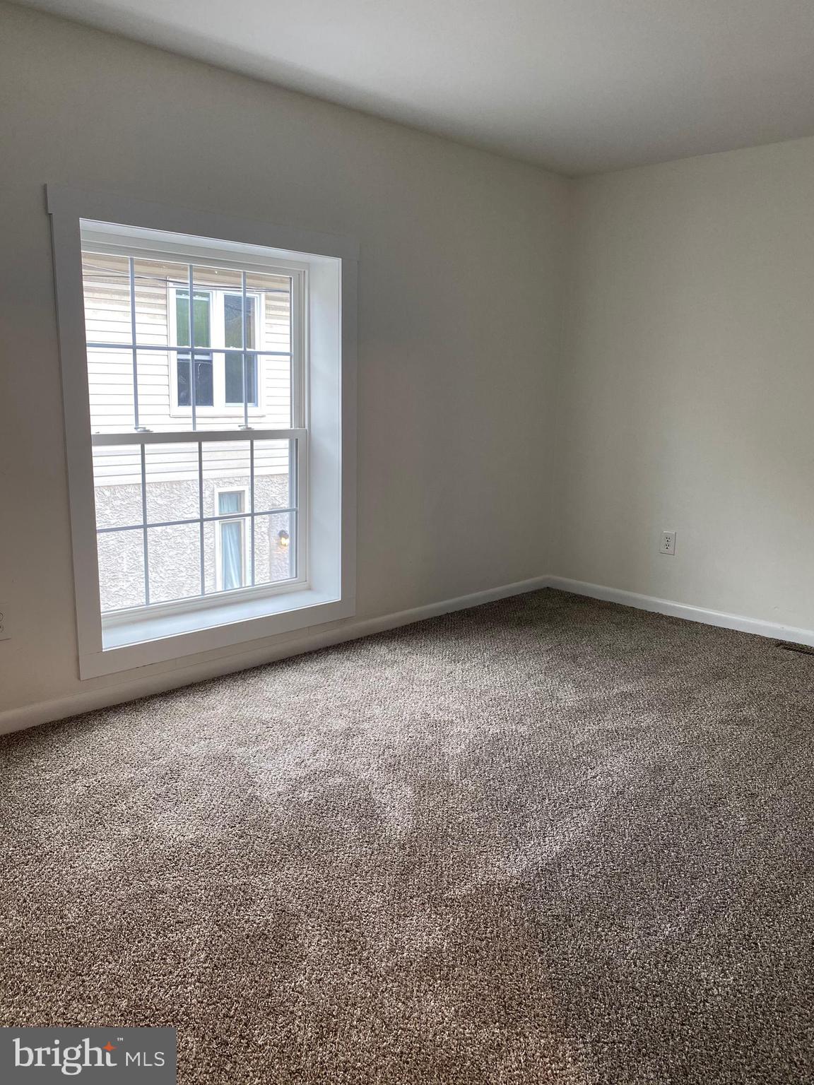 323 East Chestnut Street, Unit 5 Coatesville, PA 19320 - Photo 7 of 7 an empty room with a window
