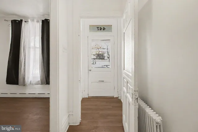 a view of a bathroom with mirror