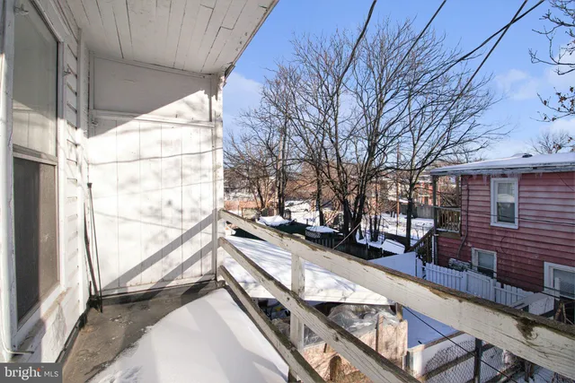 a view of a balcony with chairs