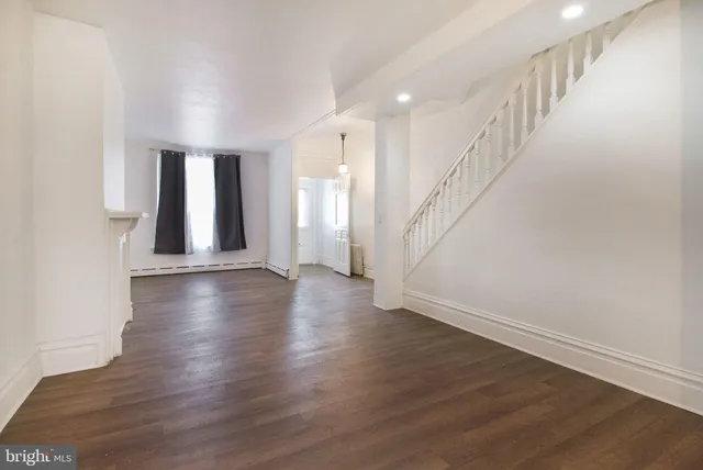 a view of an entryway with wooden floor