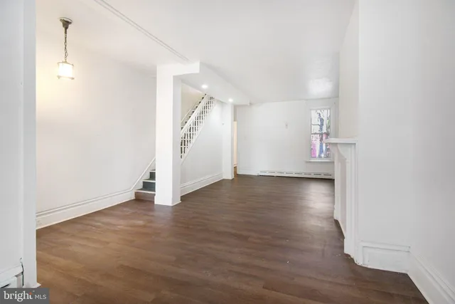 a view of a livingroom with wooden floor