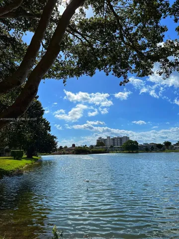 a view of lake with sunset