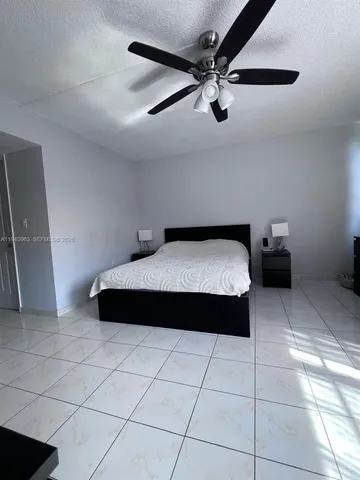 a bedroom with a bed and a walk in closet