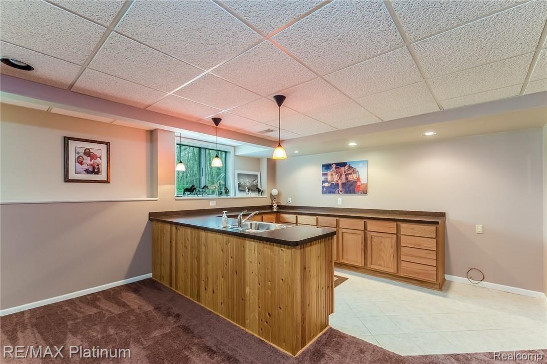 4558 North Latson Road Howell, MI 48855 - Photo 25 of 46 Kitchen Space in Lower Level features Abundant Cabinetry and sink