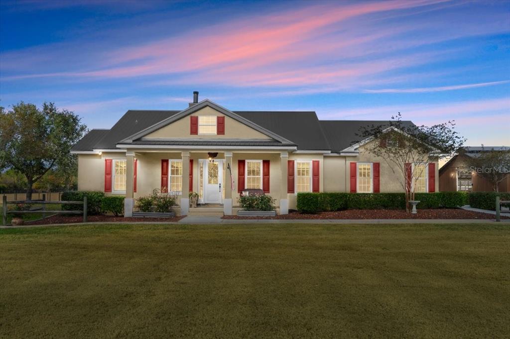 140 Little Brown Church Road Pierson, FL 32180 - Photo 1 of 1 a front view of a house with a yard