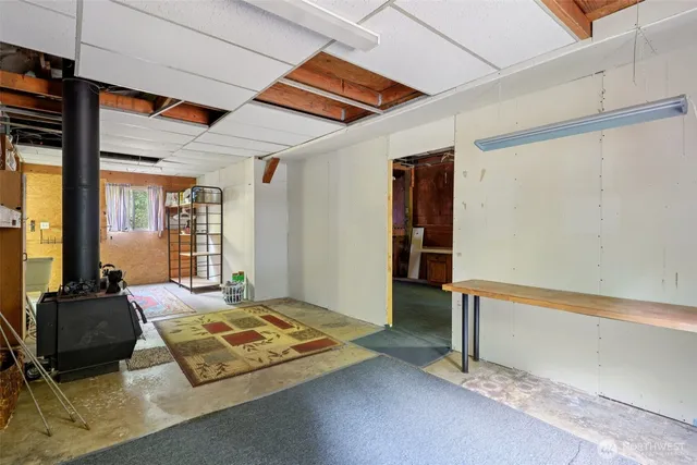 a bedroom with furniture and large windows