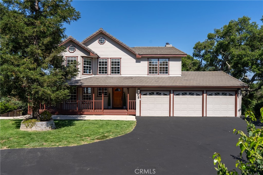10885 San Marcos Road Atascadero, CA 93422 - Photo 2 of 63 a front view of a house with a yard and trees