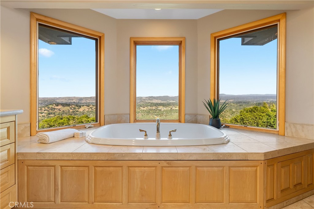 10885 San Marcos Road Atascadero, CA 93422 - Photo 26 of 63 a bathroom with double vanity and windows