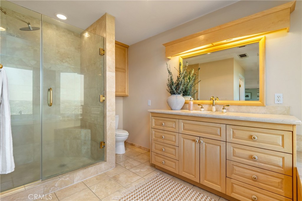 10885 San Marcos Road Atascadero, CA 93422 - Photo 27 of 63 a bathroom with a shower sink and mirror