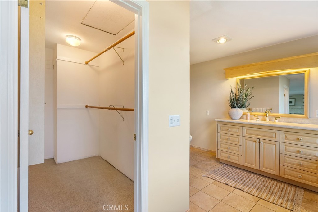 10885 San Marcos Road Atascadero, CA 93422 - Photo 28 of 63 a bathroom with a sink and a mirror