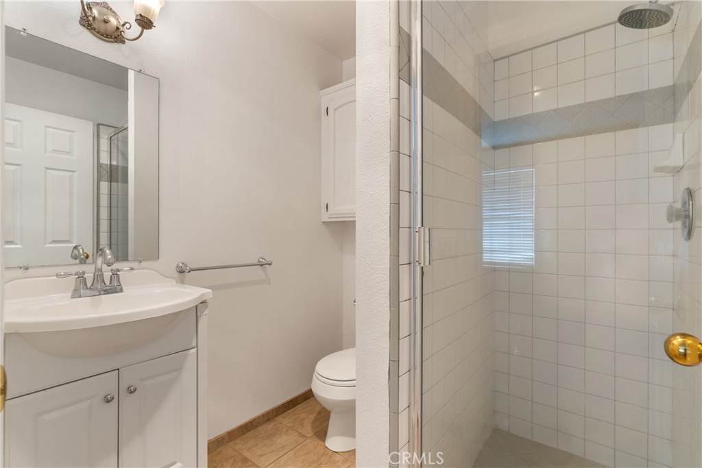 10885 San Marcos Road Atascadero, CA 93422 - Photo 30 of 63 a bathroom with a sink a toilet and shower