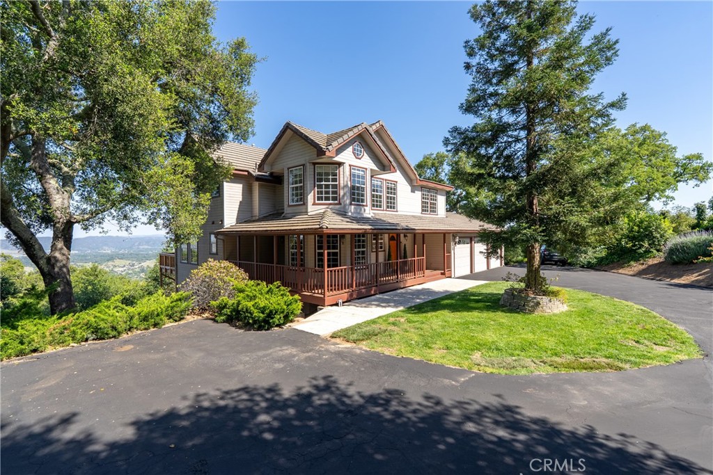 10885 San Marcos Road Atascadero, CA 93422 - Photo 3 of 63 a front view of a house with a garden