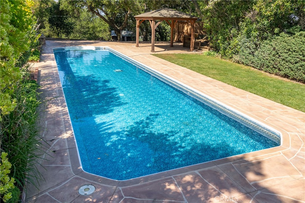 10885 San Marcos Road Atascadero, CA 93422 - Photo 41 of 63 a view of a swimming pool with a yard