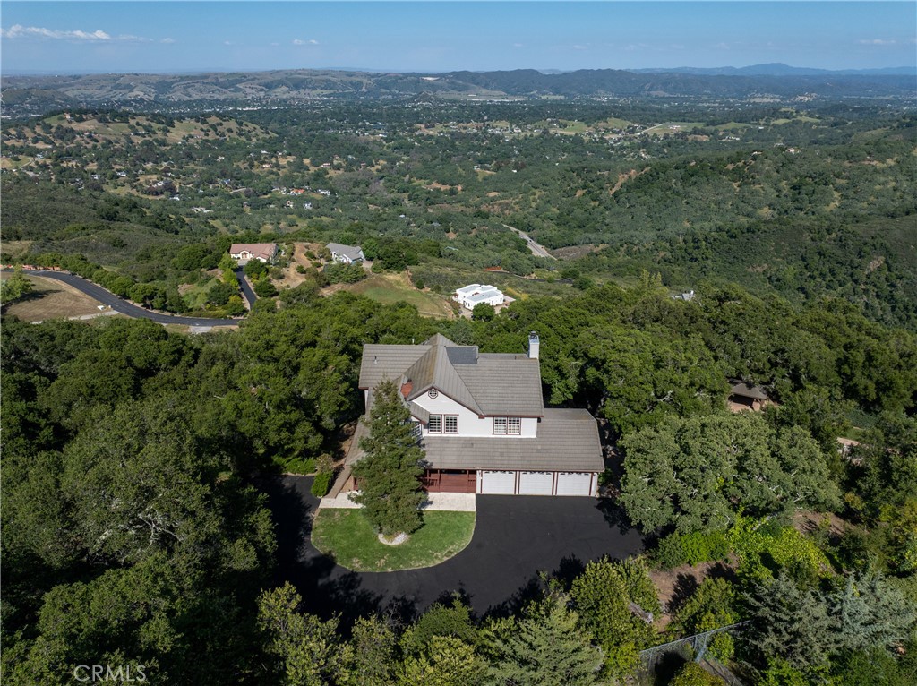 10885 San Marcos Road Atascadero, CA 93422 - Photo 58 of 63 an aerial view of a house with a garden and mountains