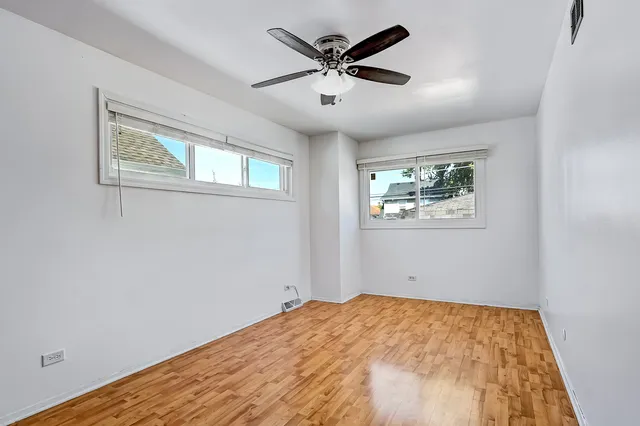 a bedroom with bed and a window