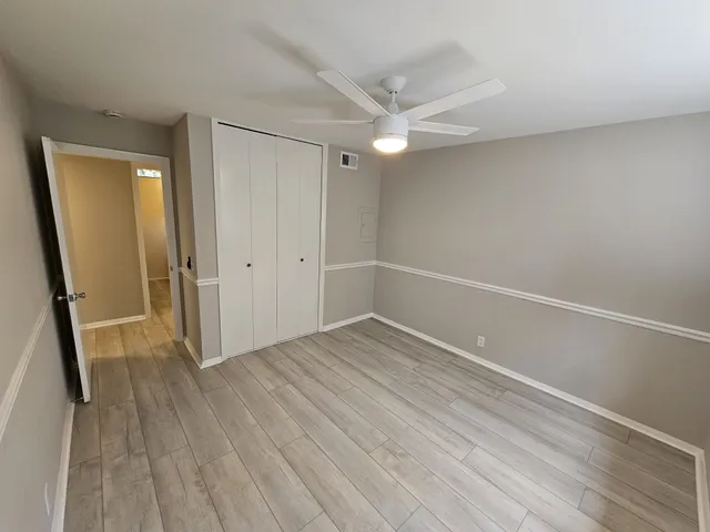 a bathroom with a toilet a sink and a mirror
