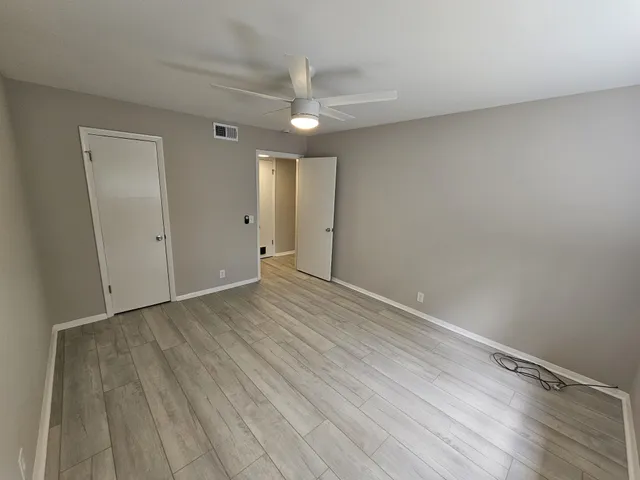 a kitchen with stainless steel appliances granite countertop a refrigerator a stove and a sink