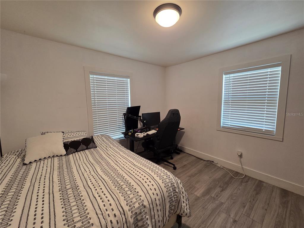 124 East F Street Frostproof, FL 33843 - Photo 18 of 37 a bedroom with a bed and a window