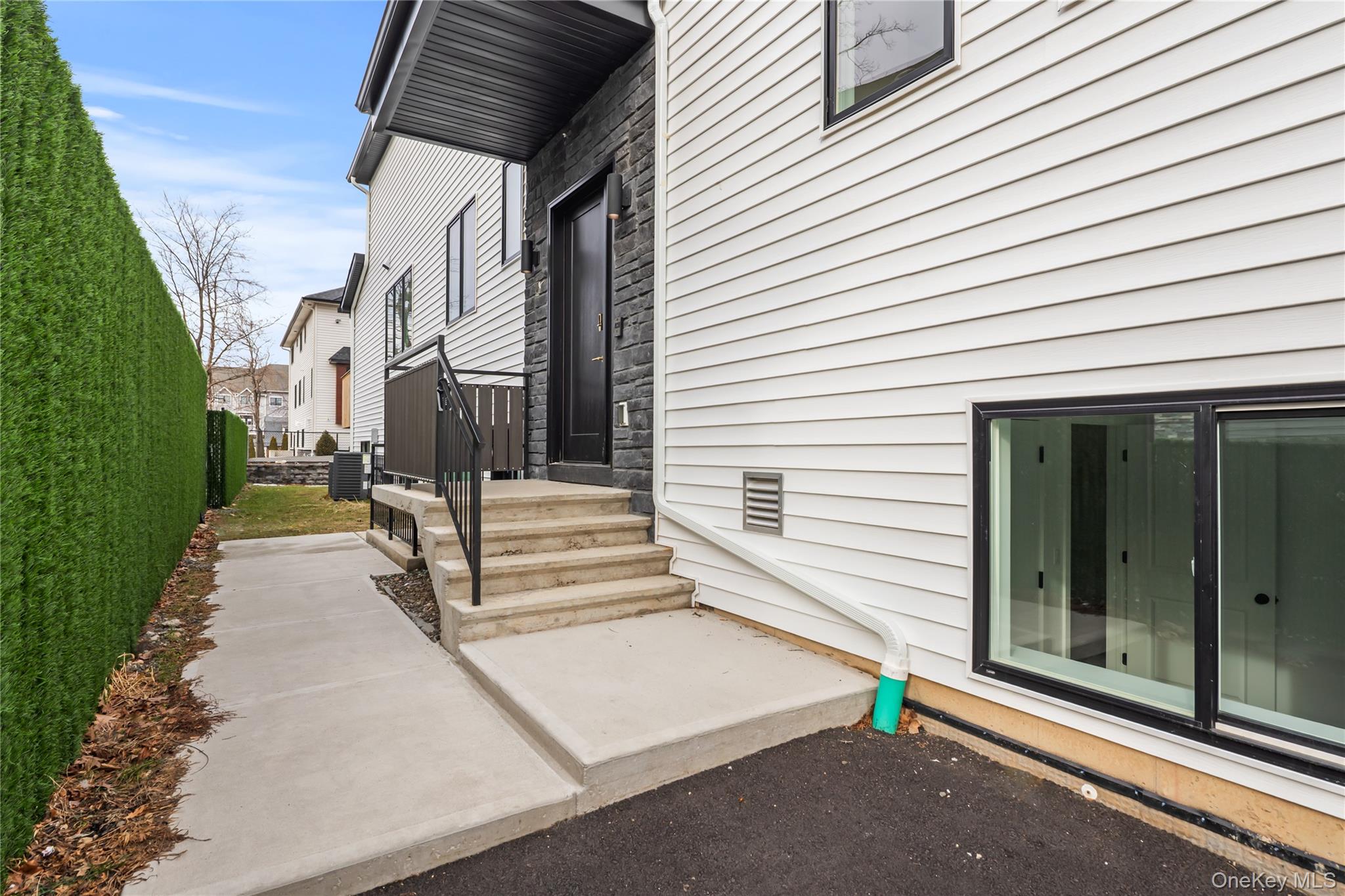 23 Singer Avenue, Unit 211 Spring Valley, NY 10977 - Photo 44 of 45 a view of a patio with table and chairs