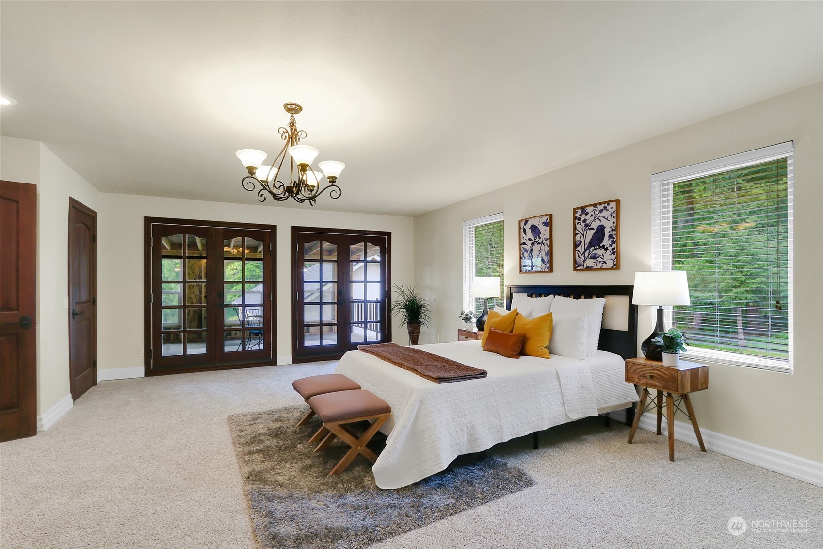 13921 Jim Creek Road Arlington, WA 98223 - Photo 22 of 35 a bedroom with a bed couch and a large window