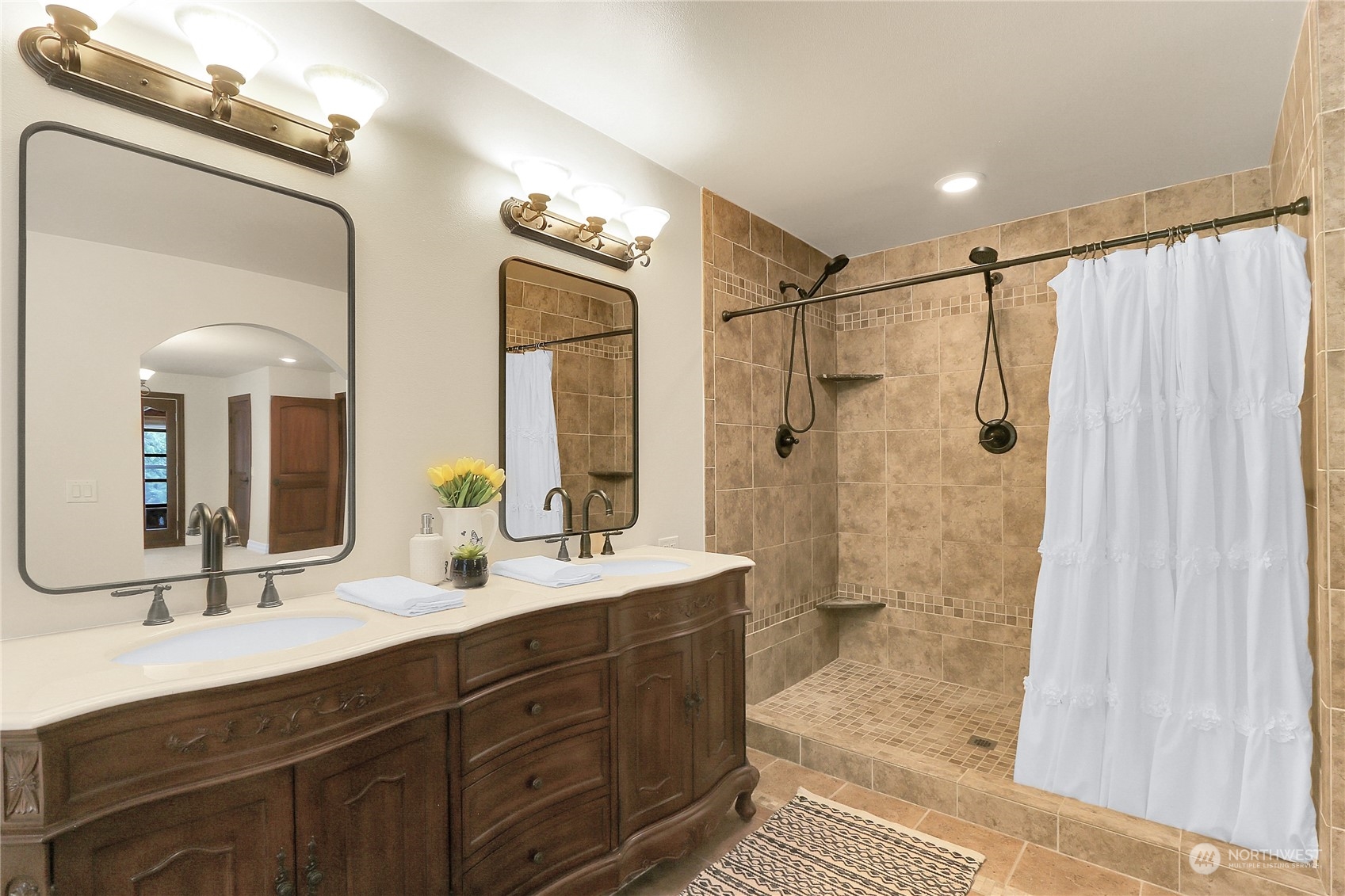 13921 Jim Creek Road Arlington, WA 98223 - Photo 25 of 35 a bathroom with a double vanity sink mirror double and shower