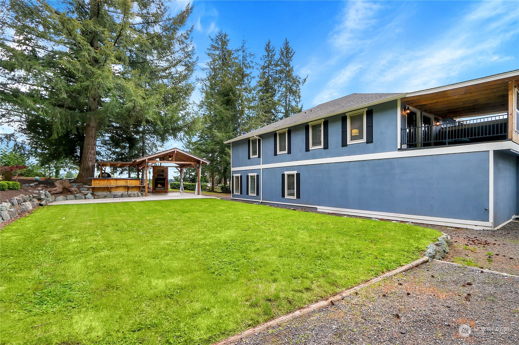 13921 Jim Creek Road Arlington, WA 98223 - Photo 31 of 35 a front view of a house with garden