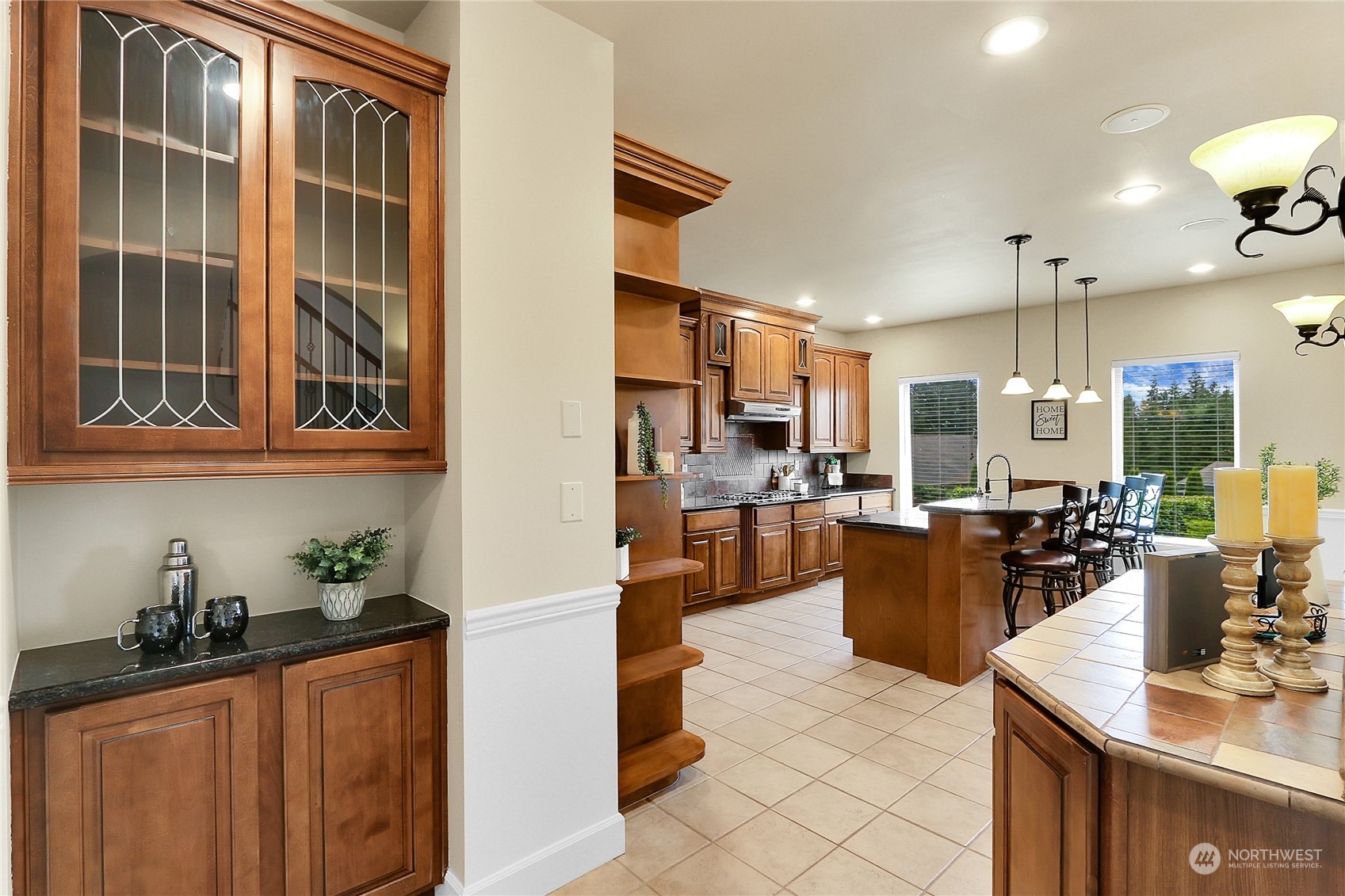 13921 Jim Creek Road Arlington, WA 98223 - Photo 4 of 35 a kitchen with granite countertop a sink dishwasher stove top oven and cabinets