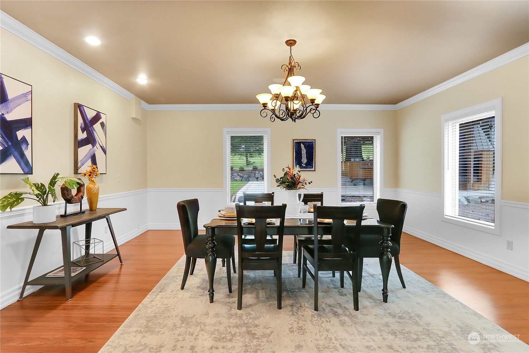 13921 Jim Creek Road Arlington, WA 98223 - Photo 7 of 35 a view of a dining room with furniture a chandelier and wooden floor