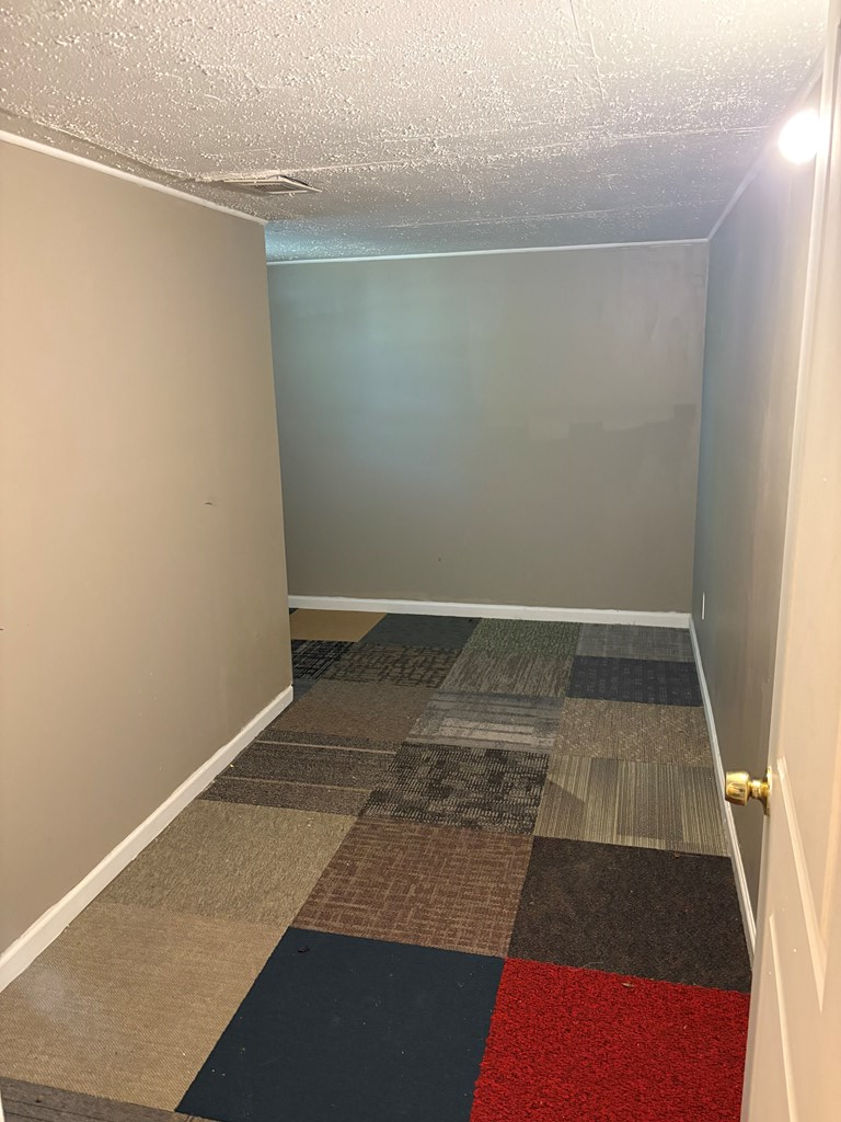 746 Fulton Avenue, Unit C Columbus, GA 31906 - Photo 4 of 5 an empty room with an empty space