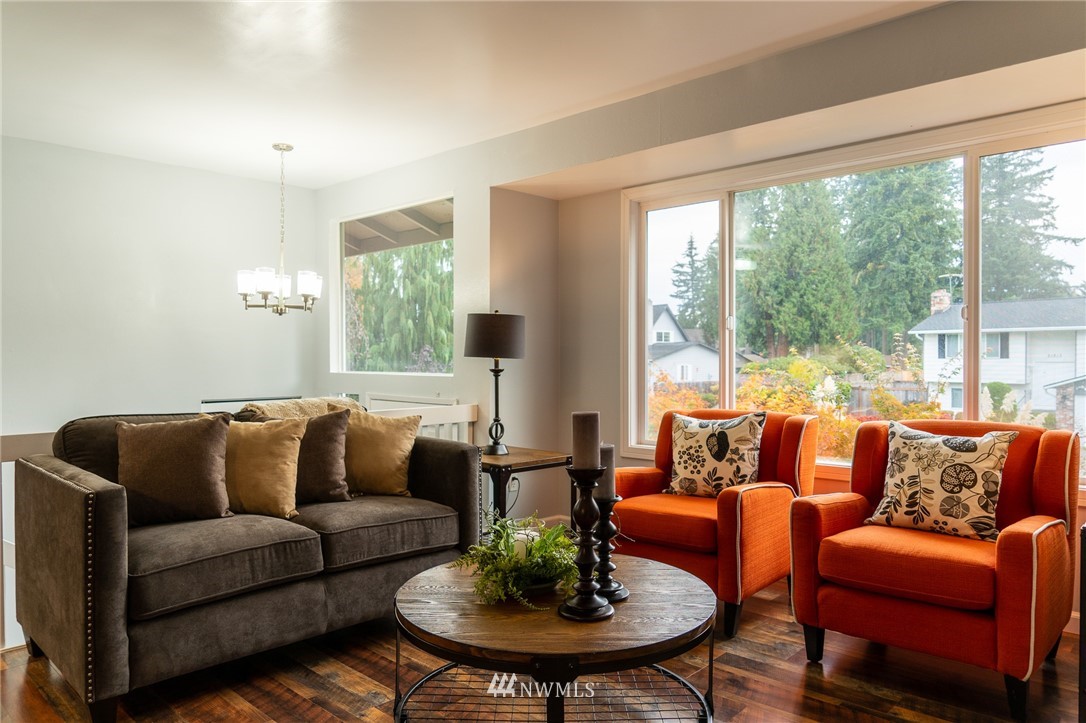 21812 2nd Avenue Southeast Bothell, WA 98021 - Photo 11 of 25 a living room with furniture and a large window