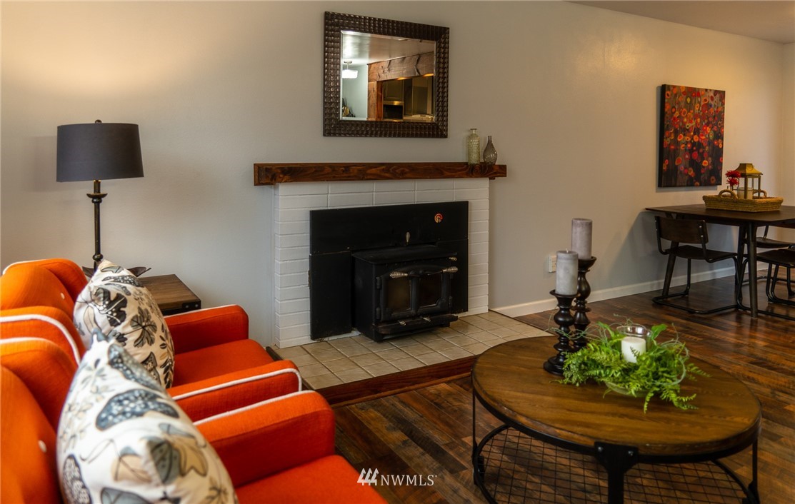 21812 2nd Avenue Southeast Bothell, WA 98021 - Photo 12 of 25 a living room with furniture and a fireplace