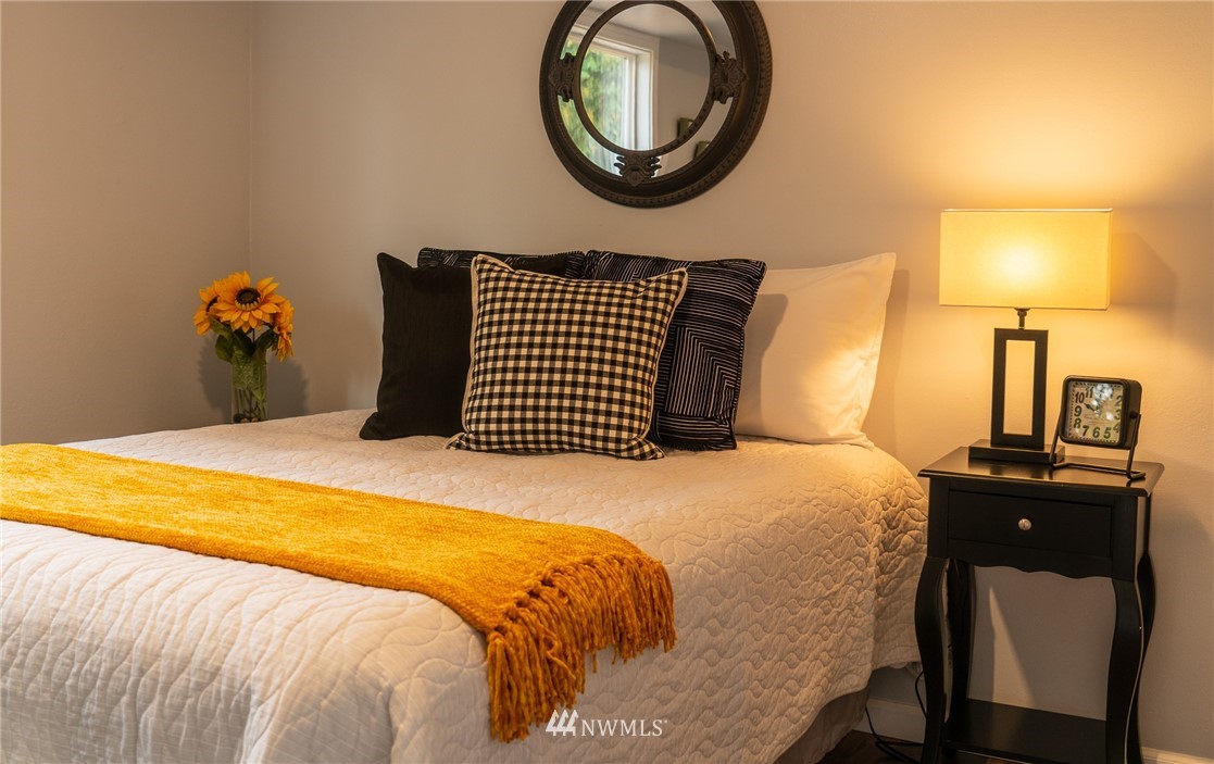 21812 2nd Avenue Southeast Bothell, WA 98021 - Photo 13 of 25 a bedroom with a bed and dresser