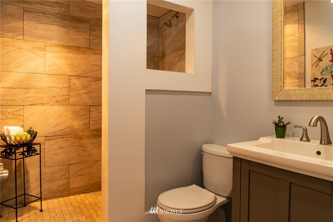 21812 2nd Avenue Southeast Bothell, WA 98021 - Photo 17 of 25 a bathroom with a sink a toilet and mirror