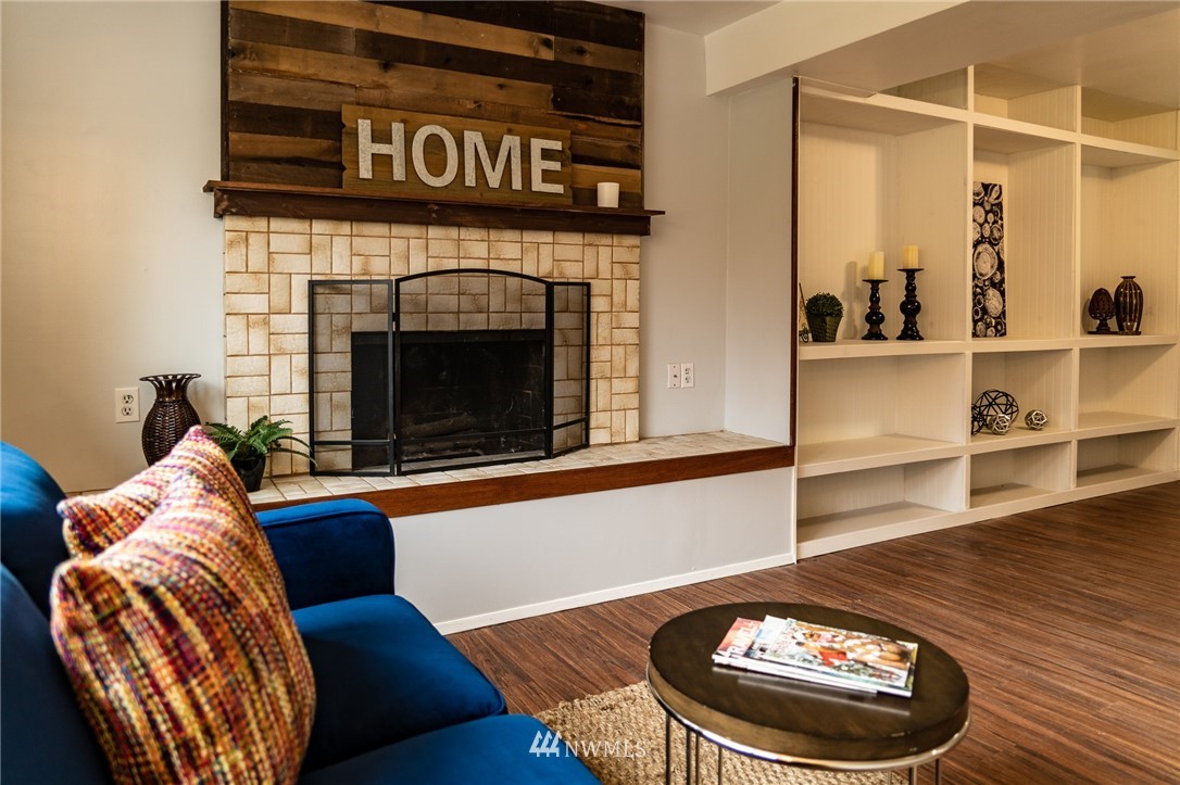 21812 2nd Avenue Southeast Bothell, WA 98021 - Photo 18 of 25 a living room with furniture and a fireplace
