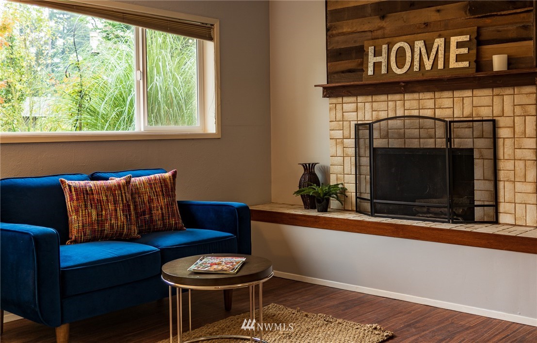 21812 2nd Avenue Southeast Bothell, WA 98021 - Photo 19 of 25 a living room with furniture and a fireplace