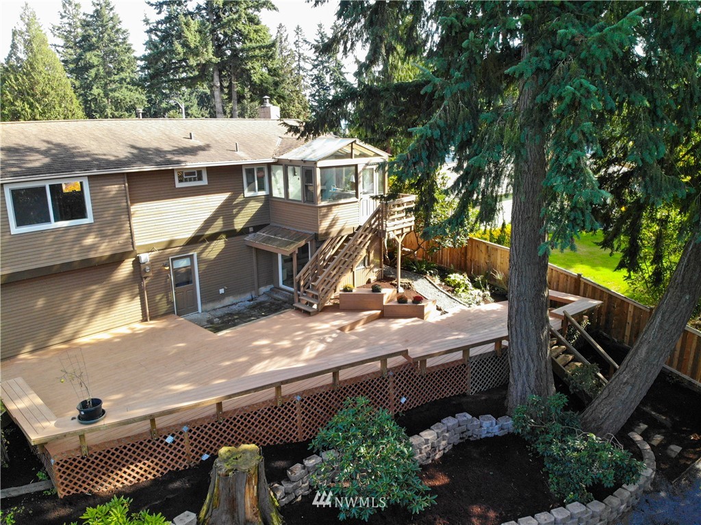 21812 2nd Avenue Southeast Bothell, WA 98021 - Photo 24 of 25 a view of a patio with table and chairs and potted plants