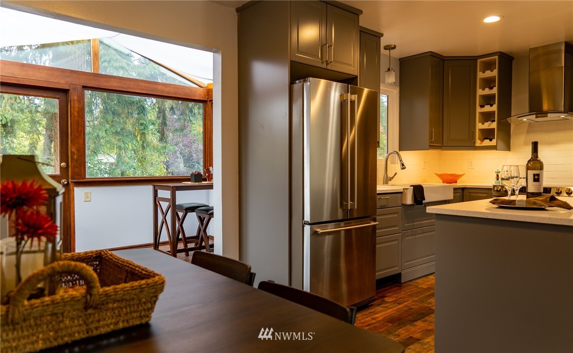 21812 2nd Avenue Southeast Bothell, WA 98021 - Photo 6 of 25 a kitchen with stainless steel appliances granite countertop a refrigerator and a sink