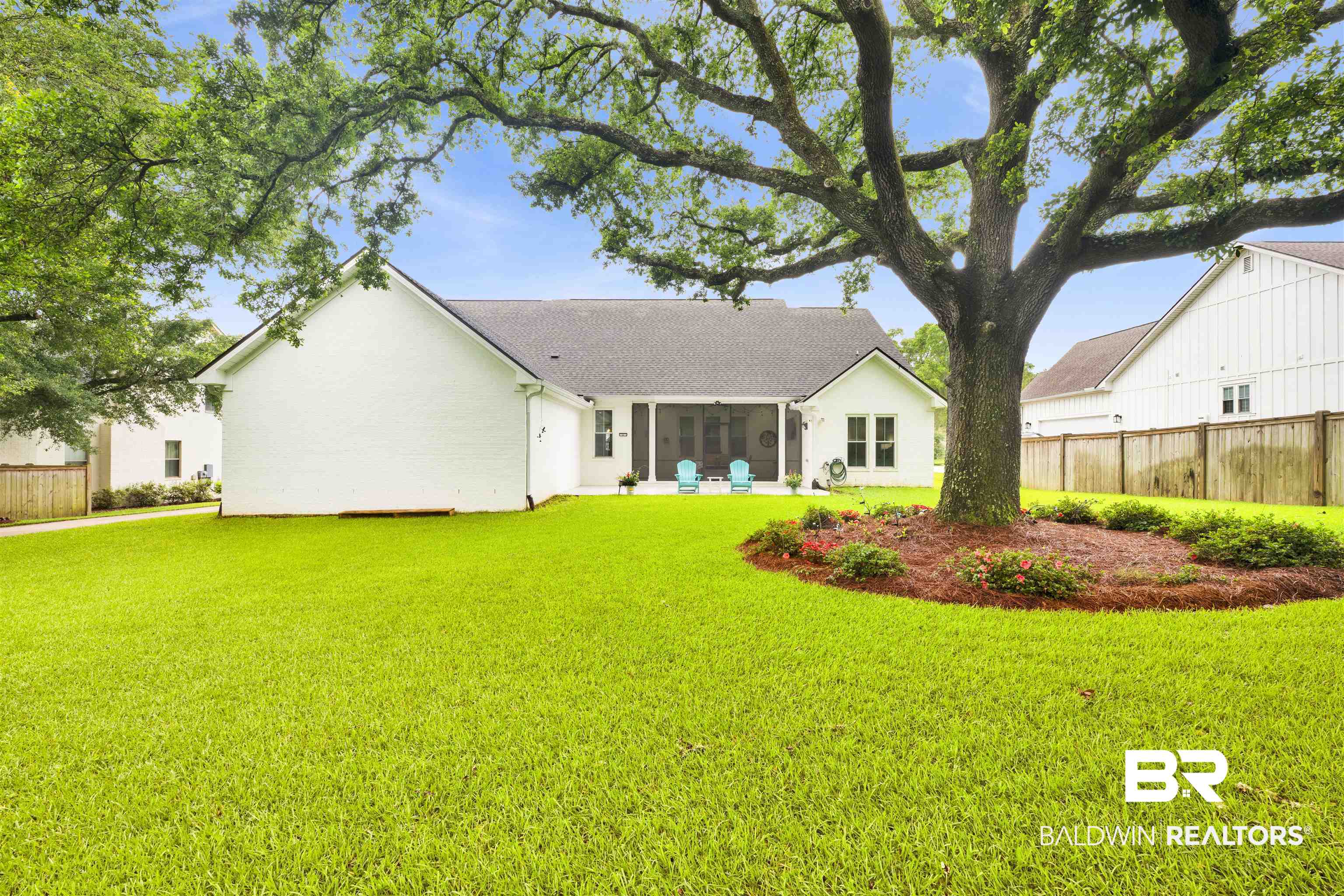 21702 Pillars Street Fairhope, AL 36532 - Photo 39 of 54 Spacious backyard featuring a substantial mature tree with a mulched bed