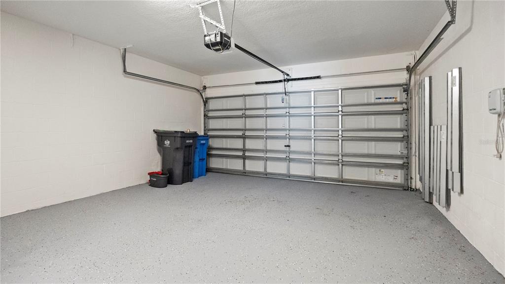 7231 Spring Snowflake Avenue Tampa, FL 33619 - Photo 17 of 46 a view of a car garage