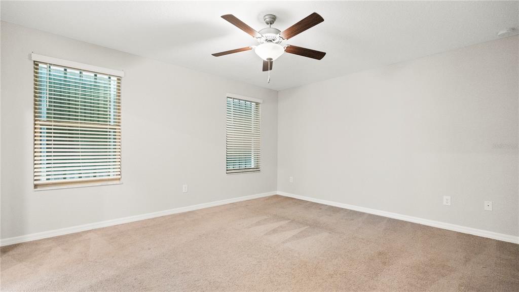 7231 Spring Snowflake Avenue Tampa, FL 33619 - Photo 29 of 46 an empty room with a window and a ceiling fan