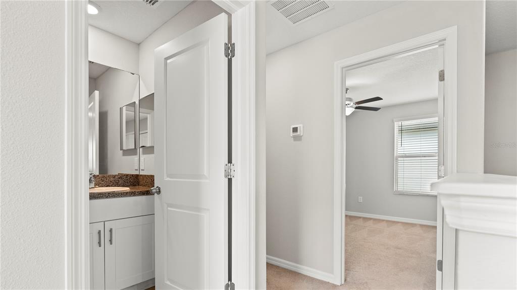 7231 Spring Snowflake Avenue Tampa, FL 33619 - Photo 34 of 46 a walk in closet with wooden floor