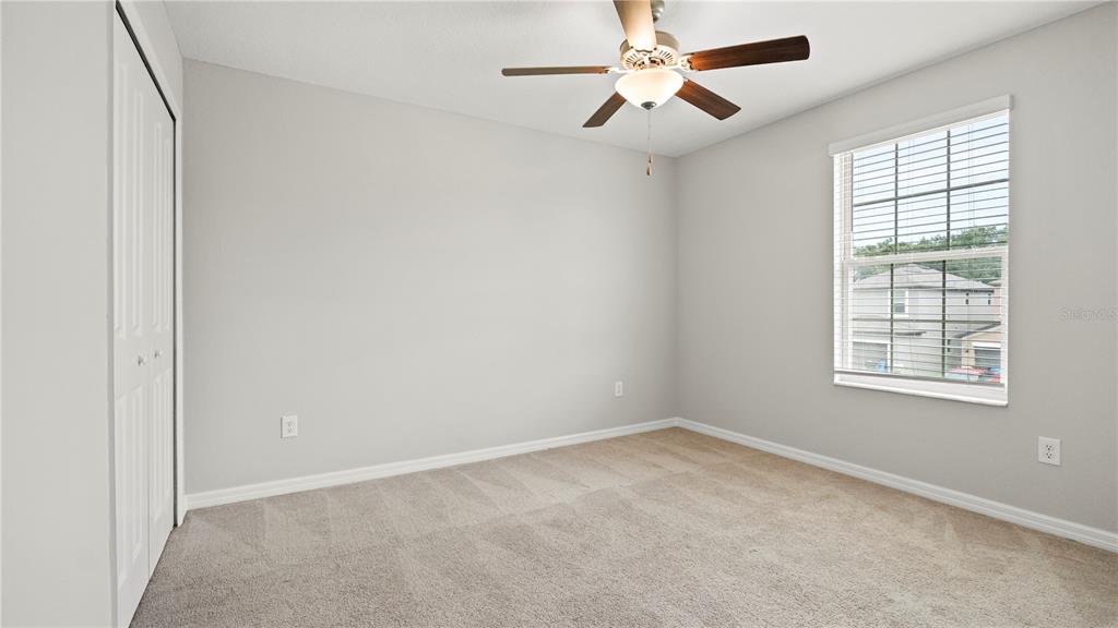 7231 Spring Snowflake Avenue Tampa, FL 33619 - Photo 37 of 46 an empty room with windows and fan