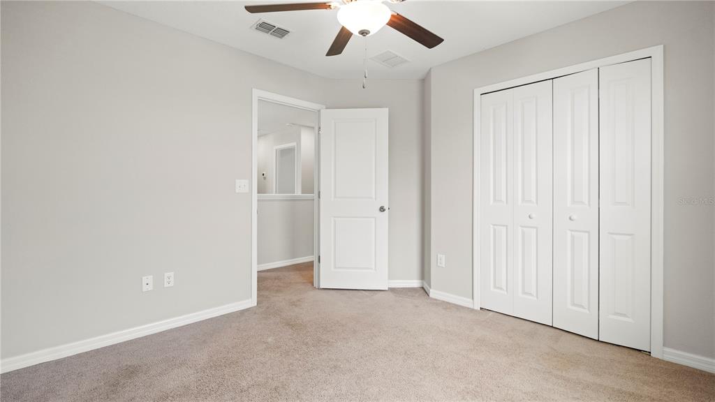 7231 Spring Snowflake Avenue Tampa, FL 33619 - Photo 39 of 46 an empty room with chandelier fan